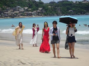 Chinese tourists parading in their best dresses for the perfect picture. 