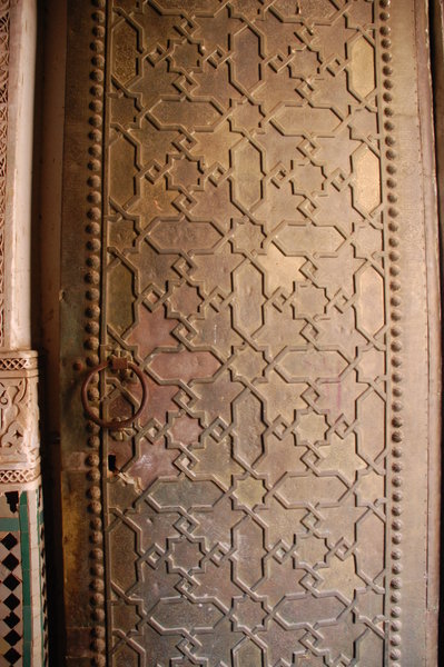 Beautiful bronze door of the Medersa
