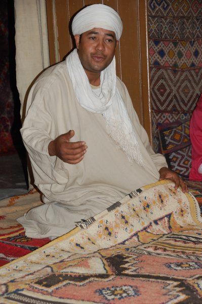 Berber carpet salesman in action