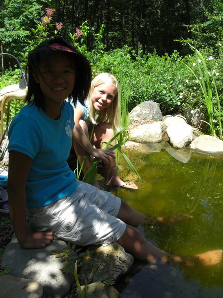 My cousins, Ya-Li and Cami, enjoying the pond at my parents' home