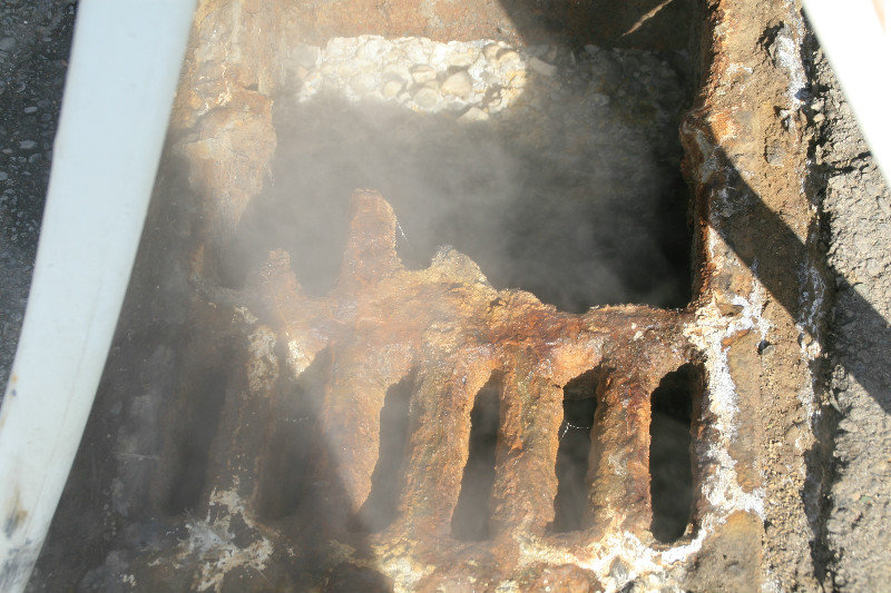 Heavy steel grate eaten away by the sulfur