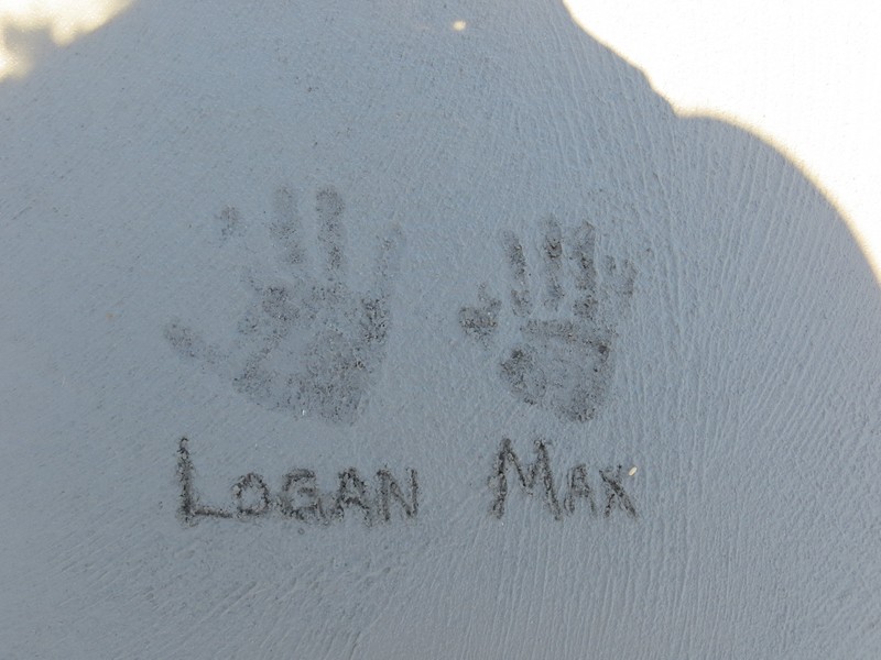 Logan and Max handprints in the floor