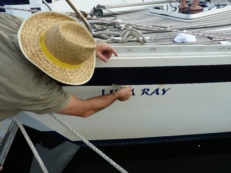 Putting on the graphics for the newly named boat