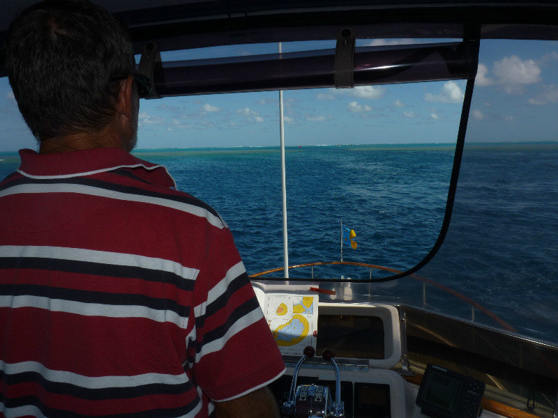 Don steers us through the narrow gap in the reef