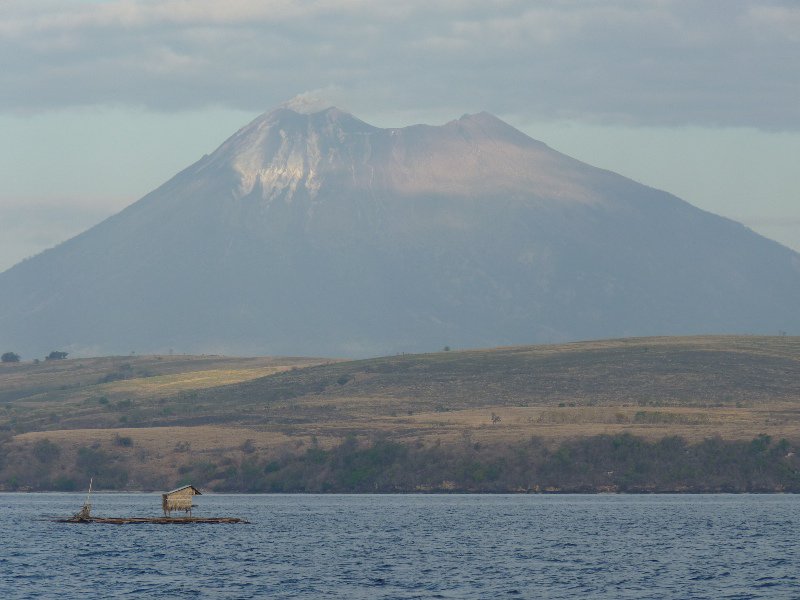 fishing platform in front of volcano