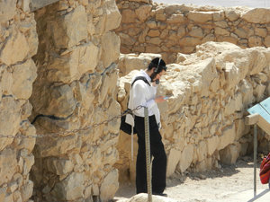 A Jewish man praying at Masada