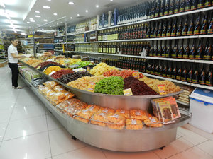 Shop with dried fruit, nuts, olives, olive oil, and candy
