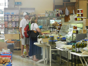 Tom, Sarah and tim buying olive oil