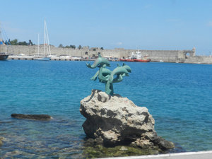Dolphin statue in Mandraki Harbor