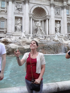 Kim flicking a coin into the Trevi fountain for good luck