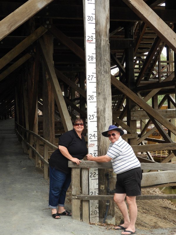 Jen & Ted with the river flood marker at the red gum wharf