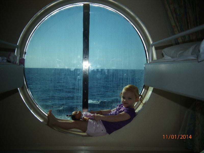 Olivia thinks their stateroom window a great place to relax