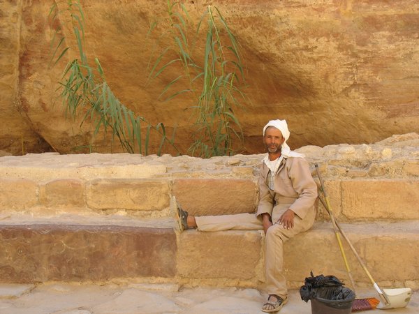 Cleaning man in the Siq