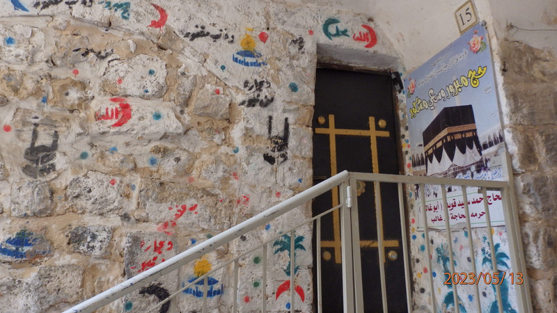 House decorated with signs of attending Haj