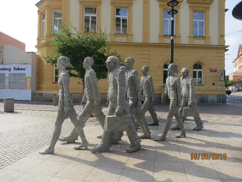 Grim-faced workers sculpture