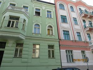 Pastel painted buidings in a residential area near the Blue Church