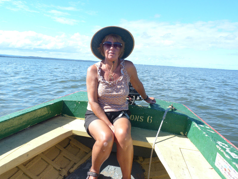 Skippering the boat on Tunggan Lake