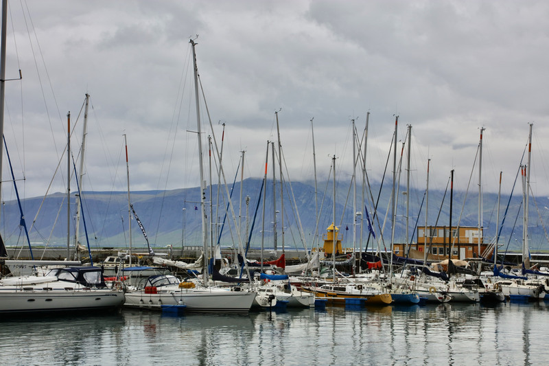 Sail boats in Reykjavik harbour and Mt. Esjan in the background
