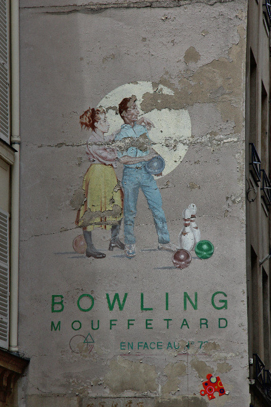 Old wall painting on Rue Mouffetard