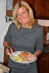 Karen serving her seafood dinner.