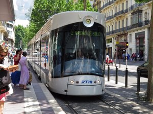 Catching the Tram on Rue de Republique