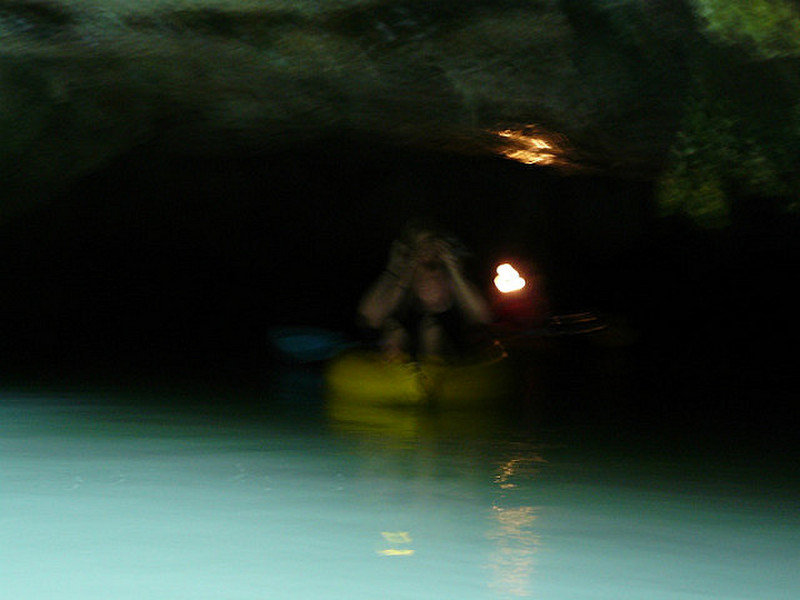 A Canoe Just Coming into a Hong from a Dark Cave