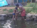 Boy washing on the backwaters