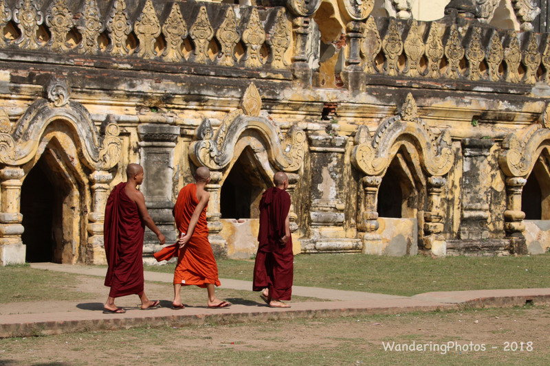 Monks in front of an ancient Buddhist Temple