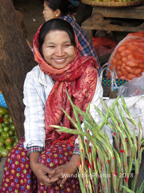 Market trader with Thanaka on her face 