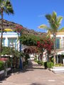 White buildings, archways & bougainvillea in Puerto de Mogan