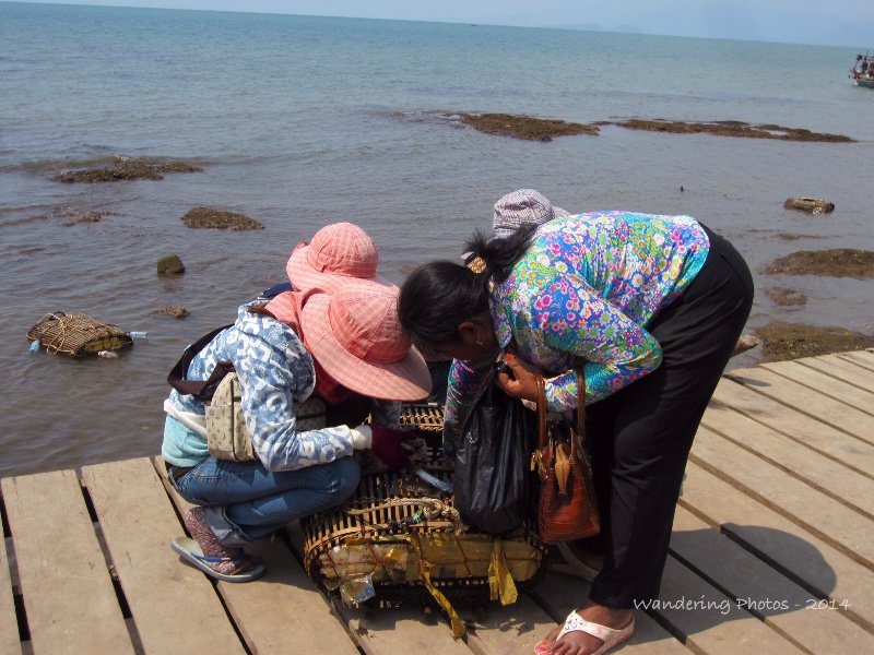 Women haggling over Kep crabs - Kep Cambodia