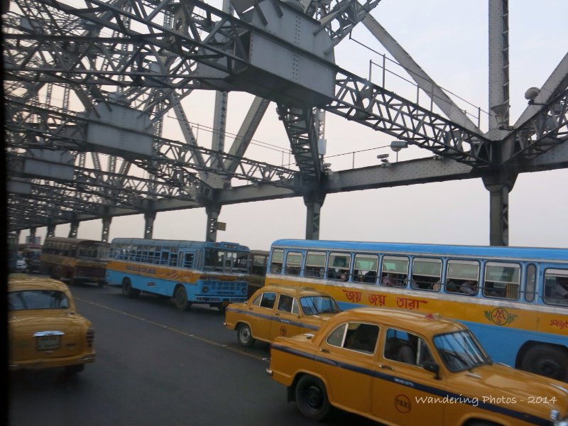 Crossing the Howrah Bridge with a few taxis and buses