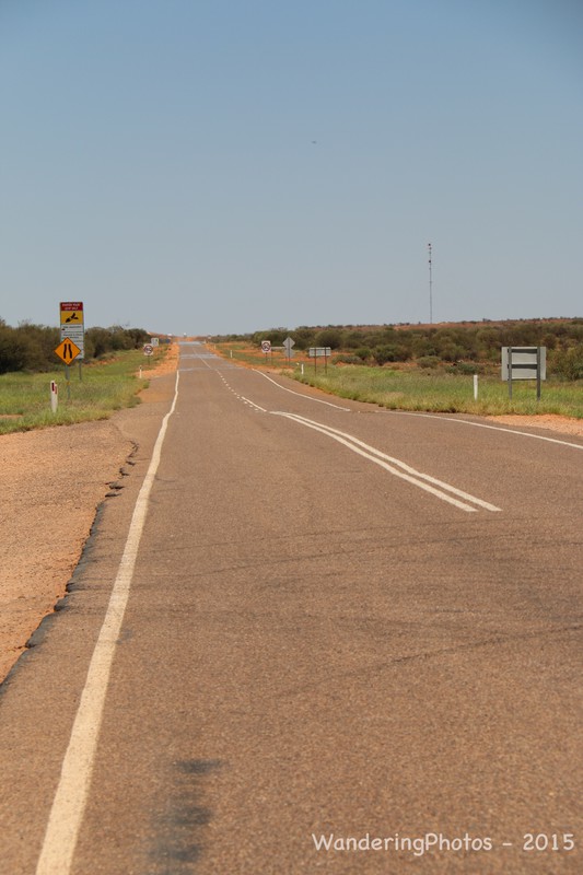The long straight Stuart Highway from Alice Springs to Uluru