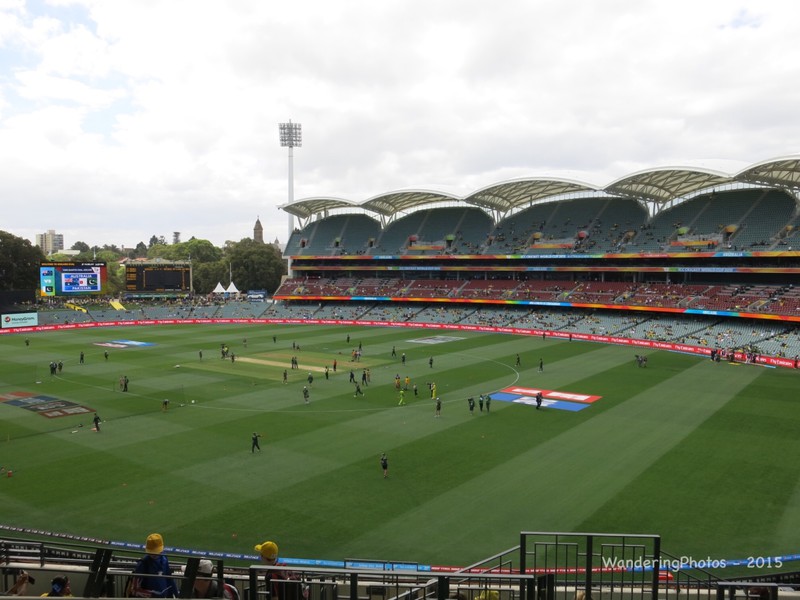 Overview of the Adelaide Oval - with both teams warming up on the ground with TV crews etc