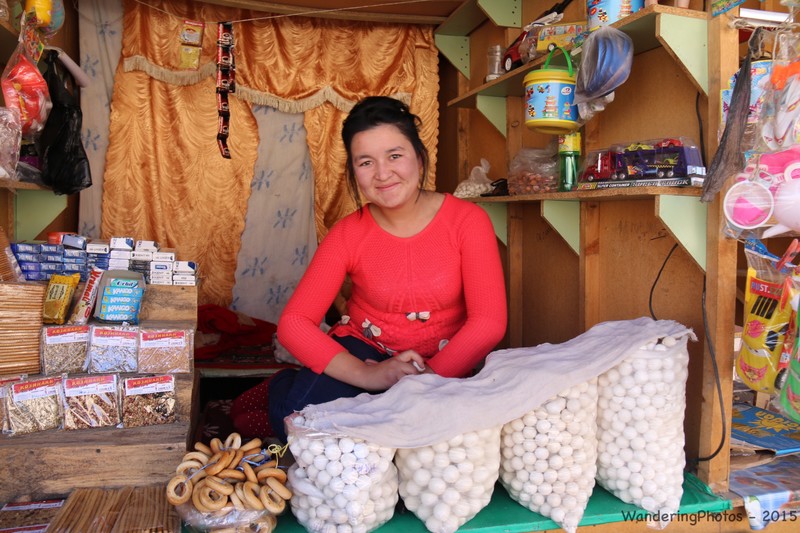 Stallholder selling balls of dried goats cheese