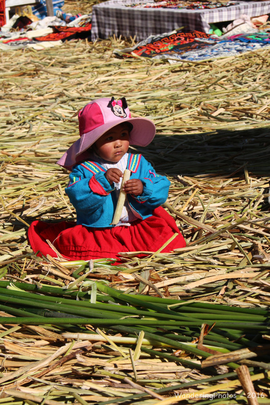 Small child on the Uros floating reed islands on Lake Titicaca