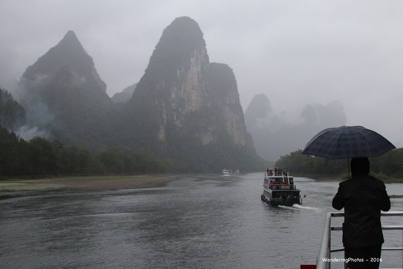 A rainy & foggy day on the Li River passing through the Limestone Karsts - Li River Guangxi China