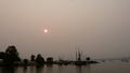 Sun, haze & boats