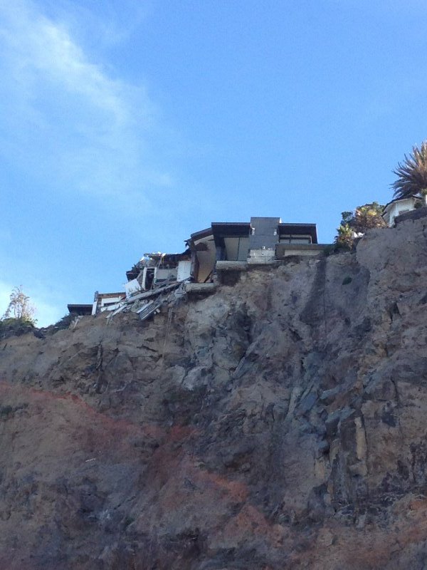 Houses still hanging off the cliff after the quake