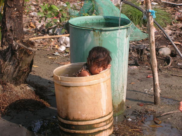 Little girl bathing in Tolu