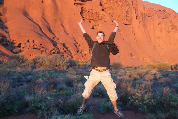 jumping around Uluru at sunrise