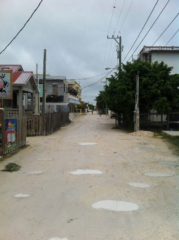 Typical street on the island, complete with tropical puddles
