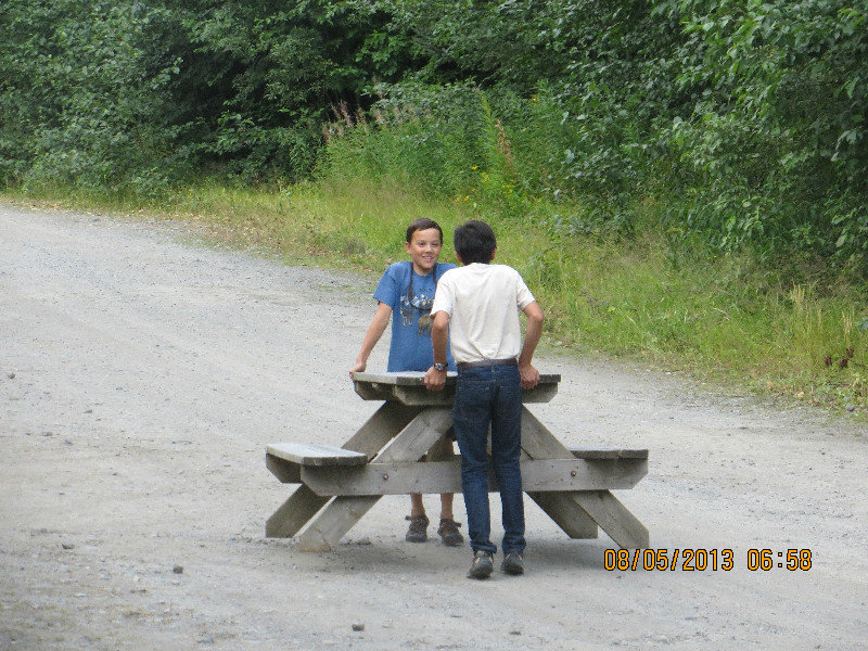Will and Henry tried to carry the picnic table alone