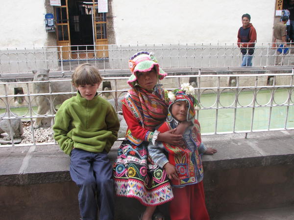 Ben and Peruvian kids in traditional dress