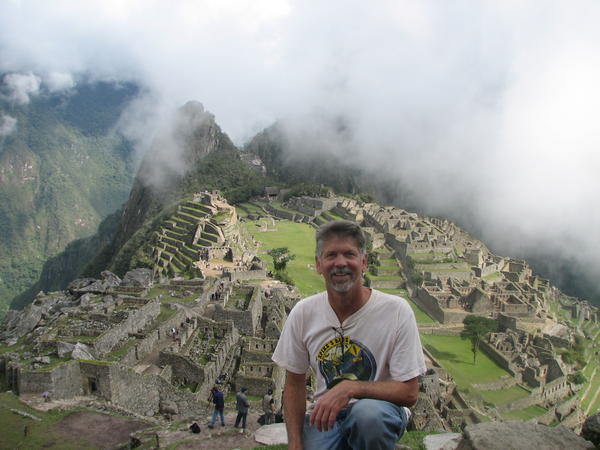 Machu Picchu with lifting morning fog and Steve