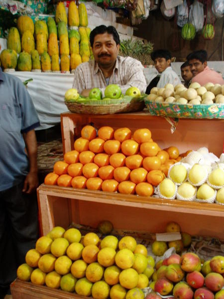 Kolkata - New Market - proud fruit stall owner