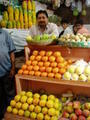 Kolkata - New Market - proud fruit stall owner