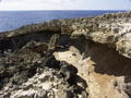 Old coral ledges on volcanic rock