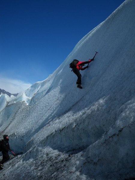 One of the Viedma guides demos ice climbing