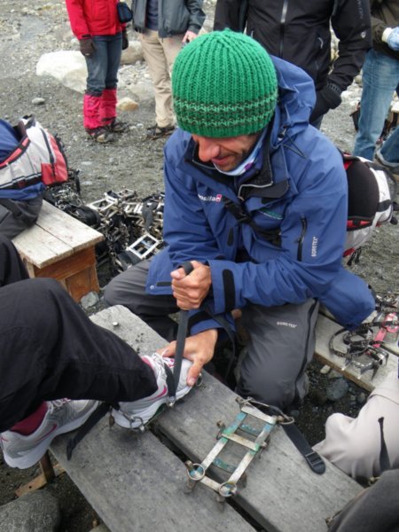 Guide puts on the crampons at Perito Moreno
